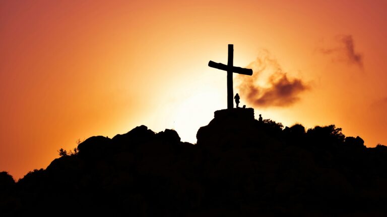 The Cross with sunset background